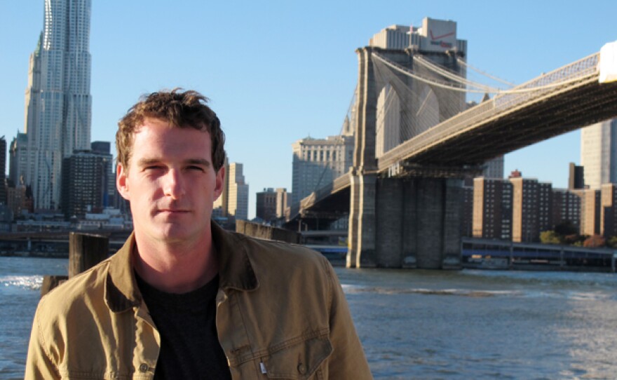 Host Dan Snow with the Brooklyn Bridge in the background, New York City.