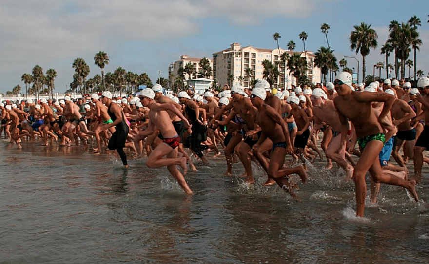 Swimmers race into the ocean for the Oceanside Labor Day Pier Swim, 2009.