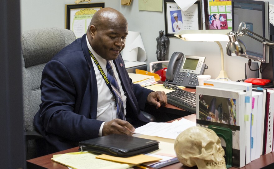 Det. Mark Williams at his desk in the Richmond, Va., police department. Today, the city's homicide clearance rate routinely hits percentages in the 80s and 90s.