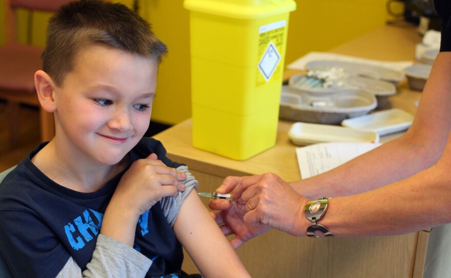 Luke Tanner, 7, gets vaccinated for measles at a clinic near Swansea, Wales, in April. Wales is at the center of a measles outbreak that has been linked to one death.