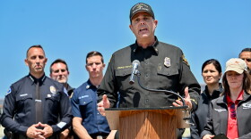 Orange County Fire Authority Division Chief Craig Covey speaks during a news conference at the Los Alamitos racetrack in Cypress, Calif., on Friday about a hazardous material situation in Garden Grove, Calif.