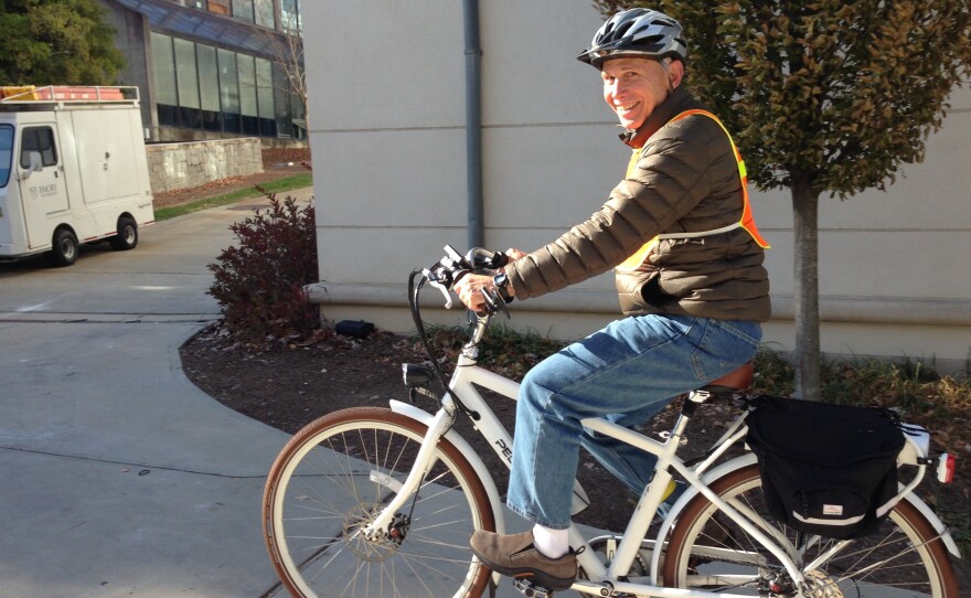 Joel Bowman, 66, rides his e-bike six miles daily to his job at Emory University in Atlanta.