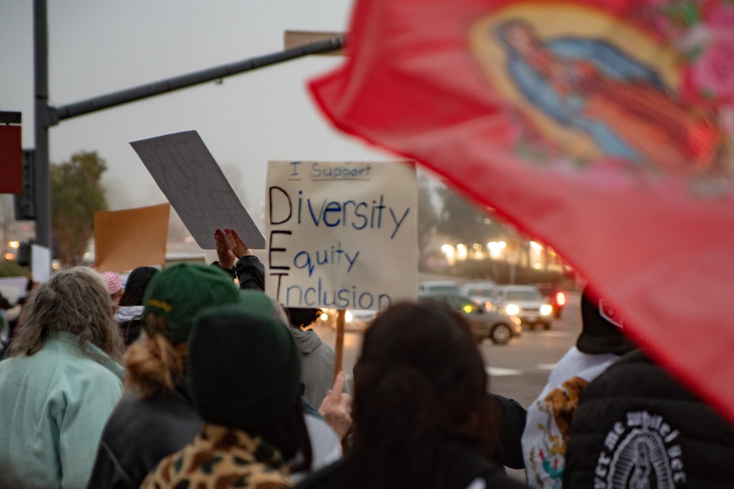 A group of protesters gather at the corner of Oceanside and College boulevards in Oceanside, Calif., on Feb. 3, 2025. They're protesting against President Donald Trump's immigration crackdown.
