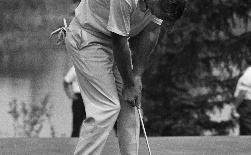 Palmer hangs his head after a double bogey on the ninth hole during the third round of the PGA Championship in Ligonier, Pa., in 1965.