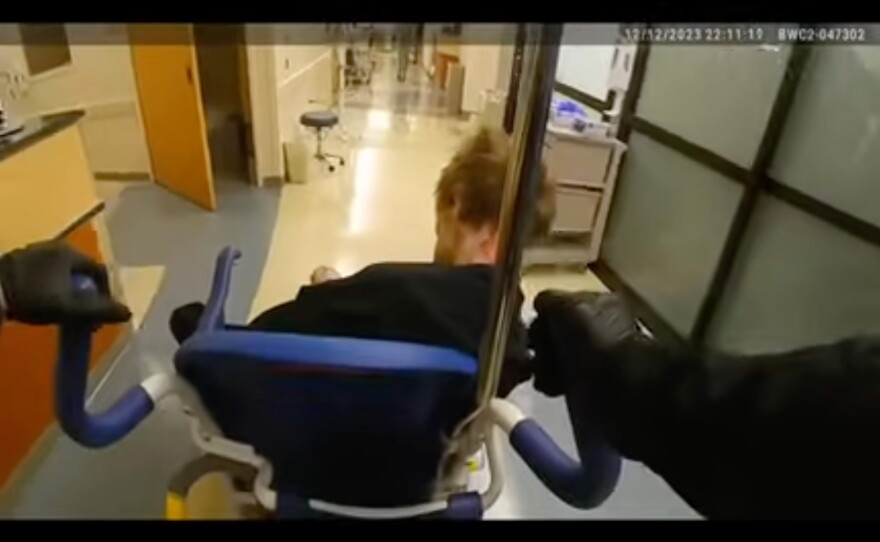 In video footage released by the Milwaukie Police Department, an officer can be seen rolling Descamps in a wheelchair to exit the hospital emergency room. "Do you feel at all comfortable with anything that's going on right now?" one police officer asked. Another officer answered, "No." 