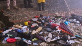 The shoes of victims of a deadly stampede sit by the main entrance of the Citadelle Laferriere in Milot, Haiti, Sunday, April 12, 2026.