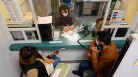 Patients make a doctor's appointment at the Santa Clara Valley Health Center in San Jose on Dec. 9, 2021.