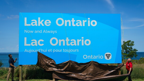 Ontario Premier Doug Ford, right, and Niagara West Member of Provincial Parliament Sam Oosterhoff unveil a sign for Lake Ontario at the Fifty Point Conservation Area in Grimsby, Ontario, Canada, on Saturday, Aug. 29, 2026. (Keito Newman/The Canadian Press via AP)