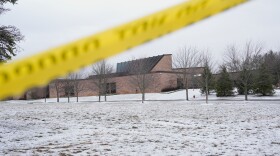 FILE - Police tape hangs outside the Temple Israel synagogue Friday, March 13, 2026, in West Bloomfield Township, Mich.
