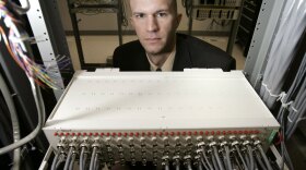 Josh Nelson, the CEO of Great Lakes Communication, stands in the computer room at his company's offices in 2007. Today, the company processes more than 2.5 million phone calls per month from distant companies providing teleconferencing and chat room services.