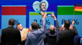 AfD supporters celebrate with a sign featuring top candidate Ulrich Siegmund after the first results of the Saxony-Anhalt state election at the party's election night gathering in Magdeburg, Germany, Sunday, Sept. 6, 2026.
