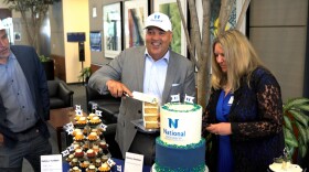  Michael R. Cunningham, interim president of National University and chancellor of the National University System, celebrates the merger with Northcentral University, Monday, with Nancy Rohland-Heinrich, vice chancellor of marketing, San Diego, CA, July 18, 2022.