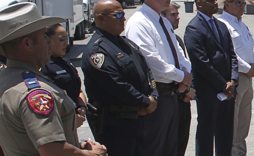 Pete Arredondo, Uvalde school police chief, third from left, stands during a news conference outside of the Robb Elementary school in Uvalde, Texas, on May 26.