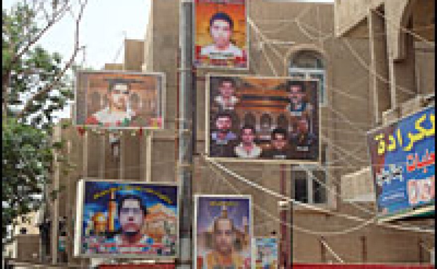 Billboards with pictures of lost loved ones hang on electricity poles in Baghdad's Karrada neighborhood.