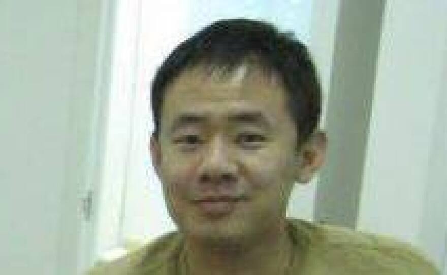 This 2009 photo released by a friend of Xiyue Wang shows Wang at his apartment in Hong Kong. Princeton University professor Stephen Kotkin, who advised Wang, defended his former student as innocent of all charges against him.