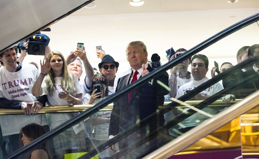 Donald Trump rides an escalator to announce his candidacy for the U.S. presidency in June 2015.