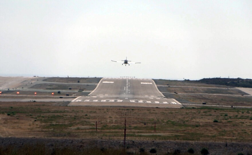 A plane landing at McClellan-Palomar Airport in Carlsbad on July 31, 2024.