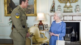 FILE - Britain's Queen Elizabeth II greets Corp. Ben Roberts-Smith from Australia, who was recently awarded the Victoria Cross, during an audience at Buckingham Palace in London, Nov. 15, 2011.