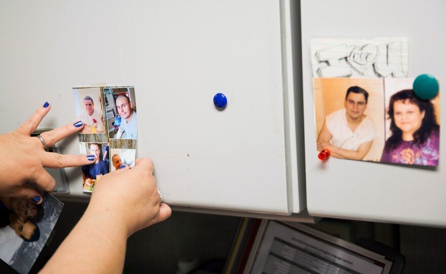 Garcia moves around photos of Mark that hang on her office cabinets at the Austin Independent School District, where she works as a data manager.