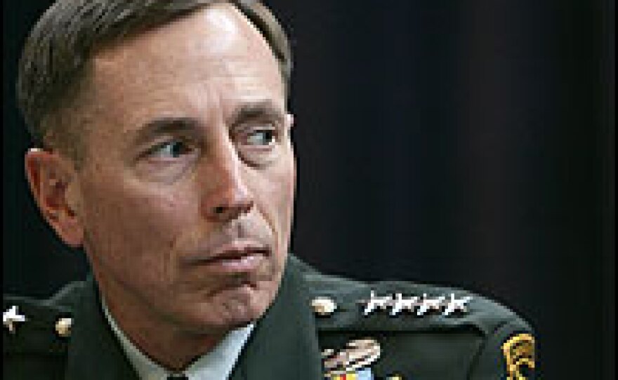Gen. David Petraeus addresses a news conference in London on Sept. 18. He was there to discuss Iraq with British Prime Minister Gordon Brown. Back home, controversy simmered over an ad denouncing him as "General Betray Us."