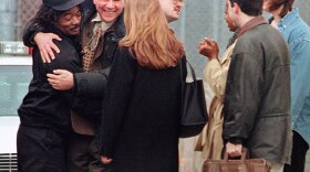 Anthony Porter (left) hugs Northwestern University journalism professor David Protess and his students outside Chicago's Cook County Jail in 1999. Porter had served more than 16 years on death row before Protess and his students developed information that led to a Wisconsin man's confessing to the 1982 double murder for which Porter was convicted.