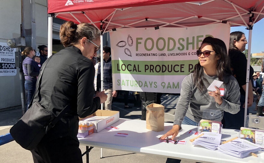Two women discuss Foodshed's mission outside of their Farm Hub in City Heights, March 14, 2022.