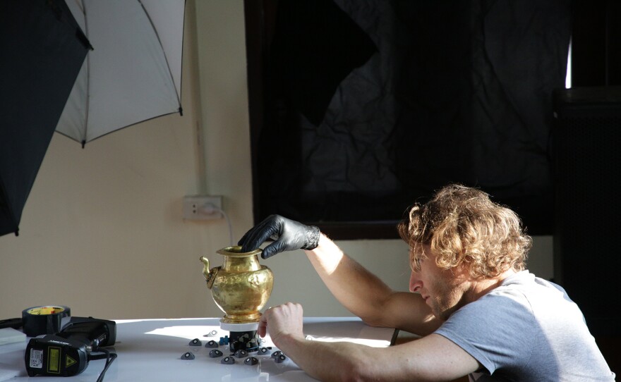 Camera operator Mikaēl Rouca assesses one of the treasures.