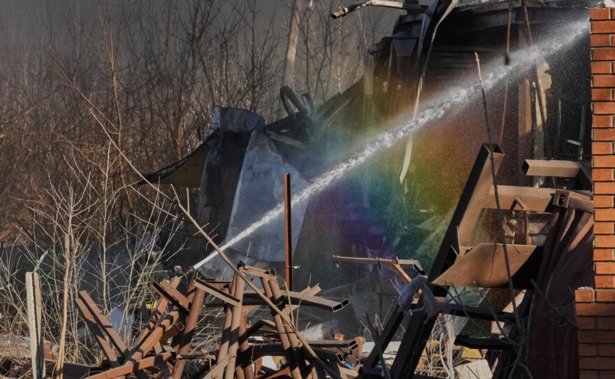 Firefighters put out the fire at railway workshops following a Russia missile and drone attack, in Brovary close to Kyiv, Ukraine, on Saturday.