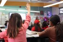 Fifth grader Frances San Giorgio raises her hand in class at Sequoia Elementary School on Thursday, Nov. 21, 2024.