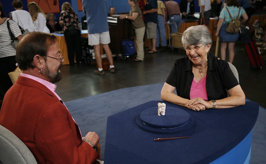 Richard Wright (left) appraises an Action Kewpie "Down on His Luck" doll, ca. 1915. ANTIQUES ROADSHOW “Vintage Orlando, Hour 2” airs Monday, Feb. 15, 2021 at 8/7C PM on PBS.