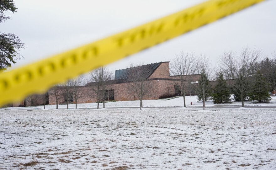 FILE - Police tape hangs outside the Temple Israel synagogue Friday, March 13, 2026, in West Bloomfield Township, Mich.