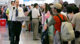 In this Aug. 10, 2006 file photo, Transportation Security Administration screener Patrick Reynolds shows items that are not allowed on flights to waiting airline passengers at the security checkin at San Francisco International Airport.