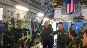 Bob Woodruff talks with a Critical Care Air Transport Team (CCATT) aboard a C-17 at Ramstein Air Base in Germany.
