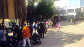 Hundreds of people are in line at Golden Hall for San Diego's Project Homeless Connect where they will receive clothes, meals, counseling and other services, Jan. 25, 2017. 
