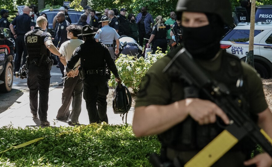 Police officers arrest a protester as pro-Palestinian students demonstrate at Emory University on Thursday.