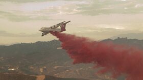 An aircraft drops fire retardant at Camp Pendleton, Sept. 28, 2016.