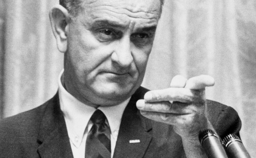 Lyndon B. Johnson delivers a speech 28 July 1965 in the White House in Washington, D.C.