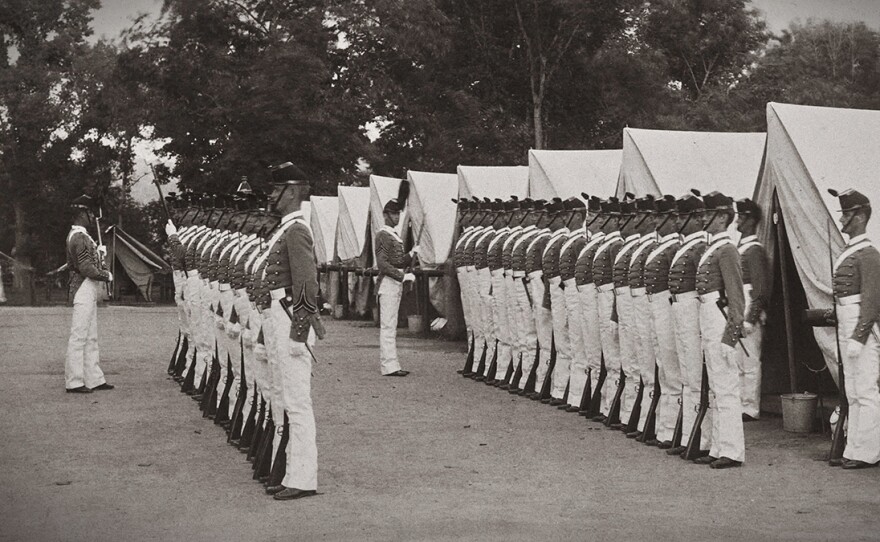 Cadets in tents and inspection, 1889 yearbook from West Point.