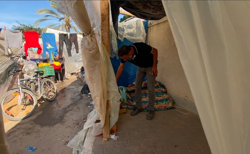 The modest interior of the shelter where displaced Palestinian Yaser al-Amor is staying with his family.