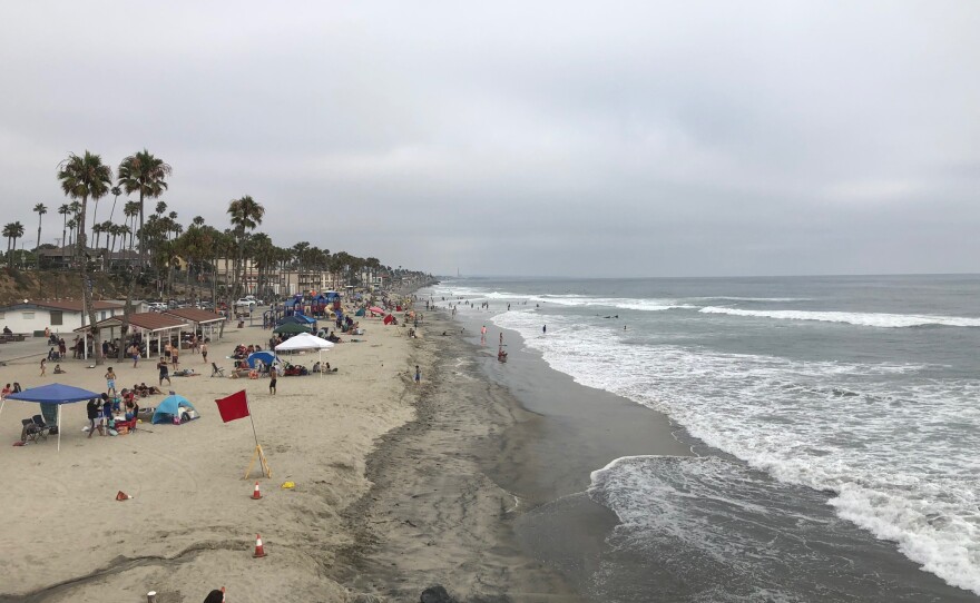 Oceanside beach narrows to nothing south of Wisconsin Street. The wide beach in the foreground is replenished with clean sand dredged annually by the Army Corps of Engineers from the mouth of Oceanside harbor, June 11, 2019.