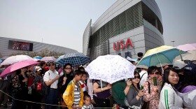 Visitors to Shanghai's World Expo waited for more than two hours on Sunday to enter the U.S. pavilion. The American exhibit formally opened Monday.