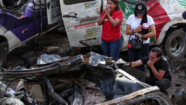 Relatives of victims pay respects at the site of an attack on the Pan-American Highway in Cajibio, Colombia, Sunday, April 26, 2026, where at least a dozen people were killed in an attack authorities blamed on dissident groups of the former FARC rebels.