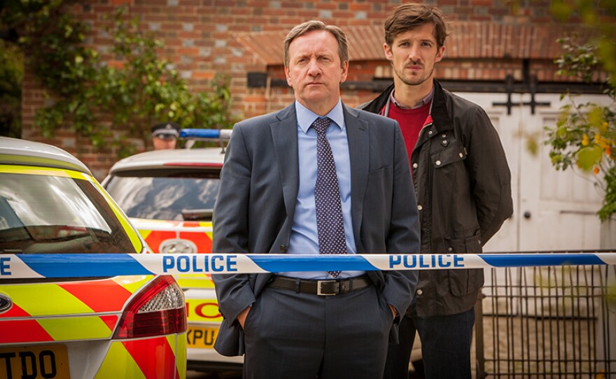 Detective Chief Inspector John Barnaby (Neil Dudgeon) and Detective Sergeant Charlie Nelson (Gwilym Lee) in a scene from MIDSOMER MURDERS “The Dagger Club.”