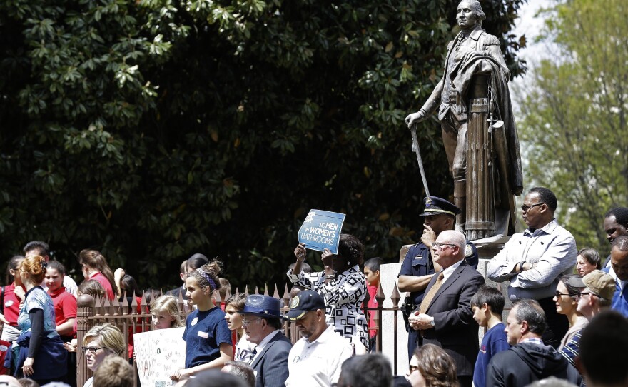 Supporters gather at the North Carolina Capitol in April in support of a law that regulates which bathrooms people can use and blocks local governments in the state from extending anti-discrimination protections to LGBT people.
