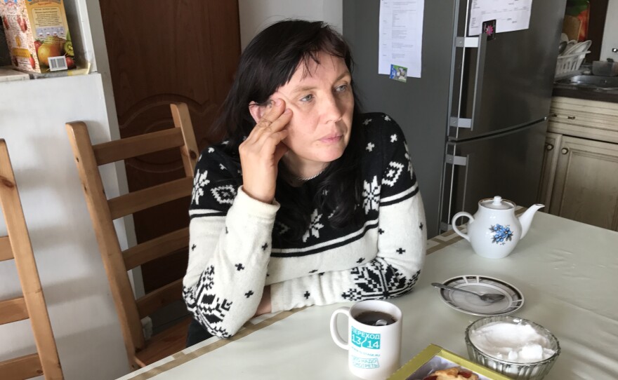 Alyona Sadikova sits in the kitchen of the women's shelter she heads on the outskirts of Moscow. "We try to get women back on their feet. This is not a hotel," she says. "We're not saviors; we want women to save themselves."