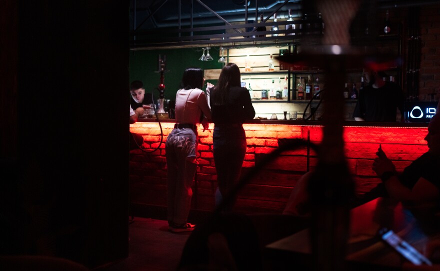 Liquor beer and hookah flow from the bar through the night.