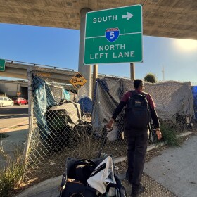 The Father Joe's Villages street health team visits an encampment near an I-5 onramp on Tuesday, Jan. 21, 2025.
