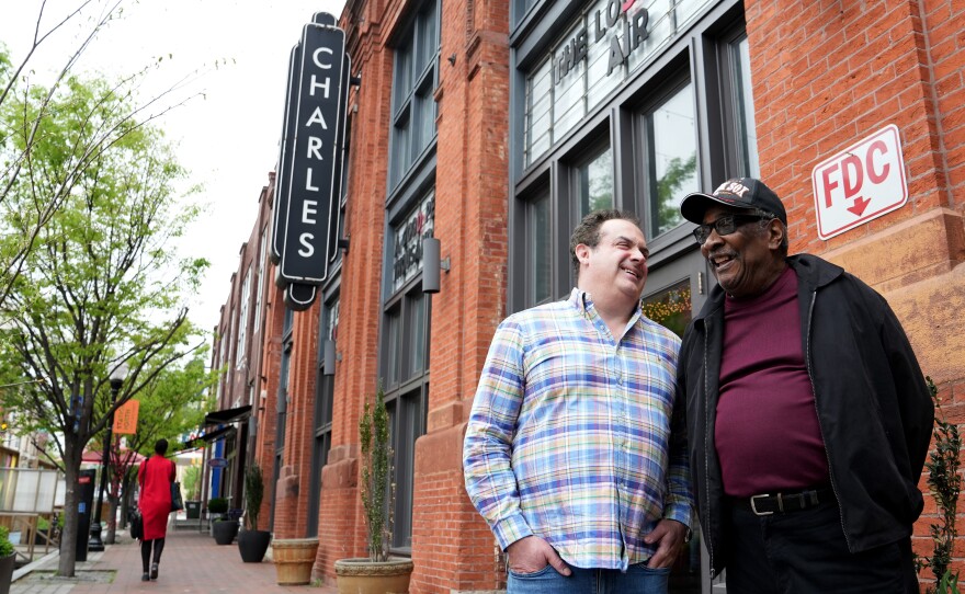 Record producer Zev Feldman (left) and John Fowler, a charter member of the Left Bank Jazz Society, meet outside the Charles Theater in downtown Baltimore. The building once hosted some of the best jazz musicians in the country.