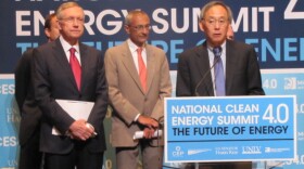 Energy Secretary Steven Chu addresses the media at the National Clean Energy Summit while Senator Harry Reid of Nevada and John Podesta of the Washington-based Center for American Progress look on. Both Reid and the Center for American Progress were sponsors of the summit.
