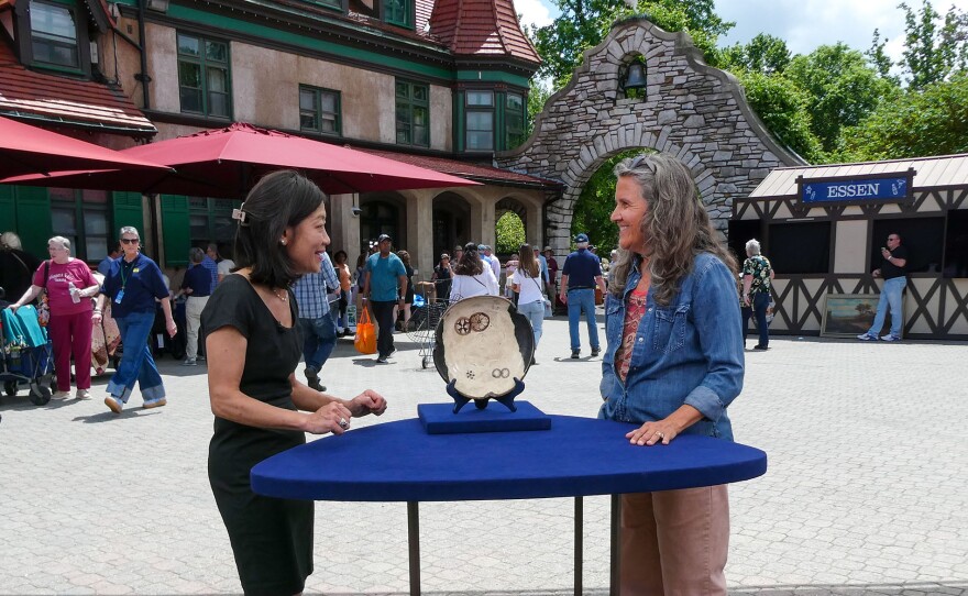 Sachiko Hori (left) appraises a Japanese Oribe-style oil dish, ca. 1850 in St. Louis, Mo. ANTIQUES ROADSHOW “Grant’s Farm, Hour 1” premieres Monday, April 27 at 8/7C PM on PBS.